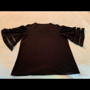 Black tunic top, very dressy. Sheer inserts in bell sleeves Very good condition
